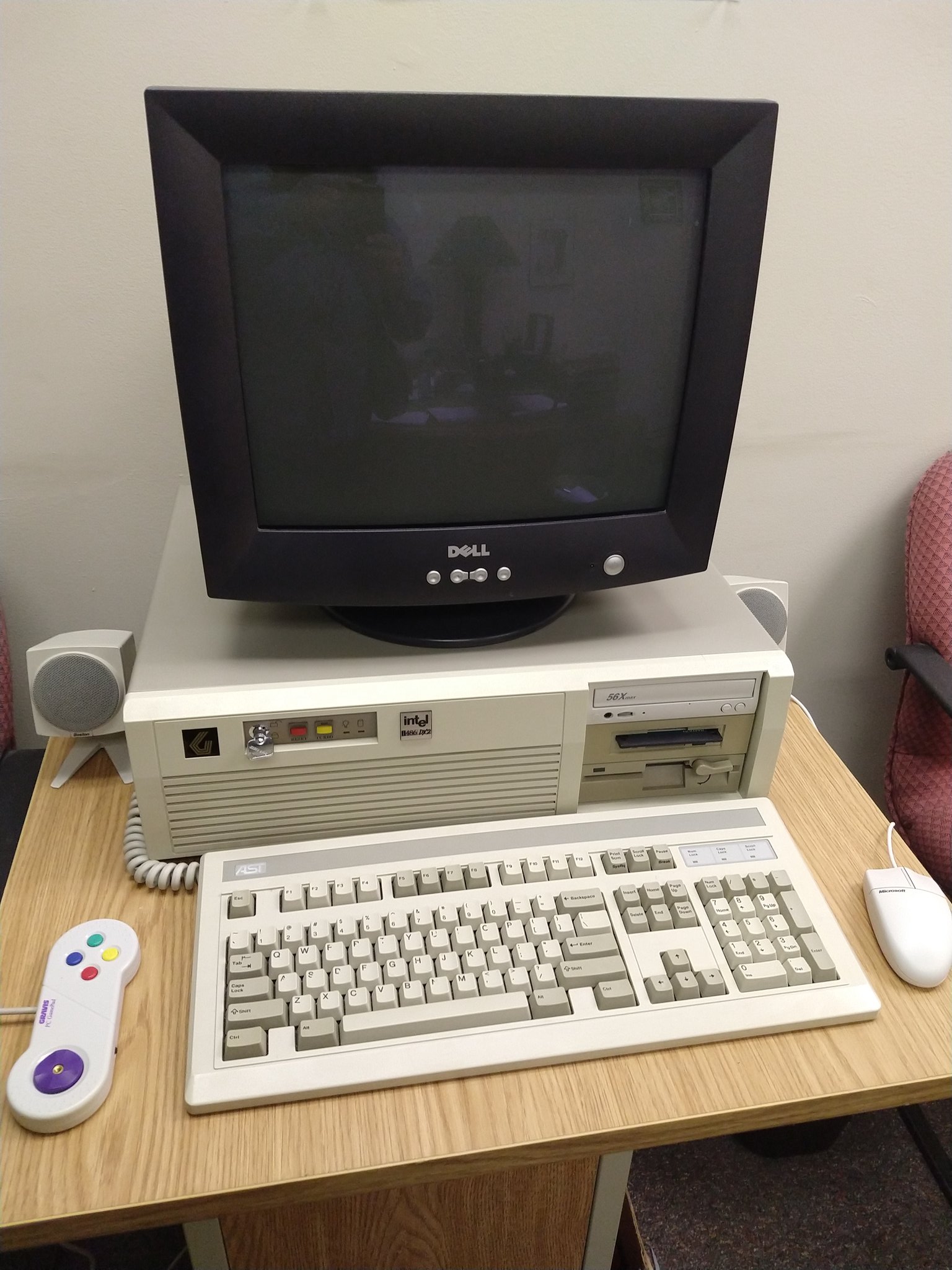 Phoenix One, my pride-and-joy 486 A 486 PC in a horizontal AT-style desktop PC case. It has an AT-style keyboard, Microsoft mouse, speakers, a Dell CRT monitor, and a Gravis PC GamePad.